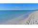 View of a tranquil beach with gentle waves meeting the sandy shoreline, a perfect coastal scene at 7820 Seville Cir, Bradenton, FL 34209
