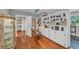 Bonus room features hardwood flooring, built in shelves, and an ornate display case at 7820 Seville Cir, Bradenton, FL 34209