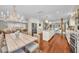 Open-concept kitchen and dining area with a central island, modern appliances, and seamless flow to living spaces at 7820 Seville Cir, Bradenton, FL 34209