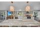 Bright kitchen with a large island, views of the pool, modern appliances and stone countertops at 7820 Seville Cir, Bradenton, FL 34209