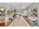 Bright kitchen with white cabinetry, stainless steel appliances, and an adjacent dining area for casual meals at 7820 Seville Cir, Bradenton, FL 34209