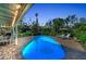 Inviting backyard pool area with lounge chairs, manicured landscaping, and a covered patio for outdoor living at 7820 Seville Cir, Bradenton, FL 34209