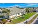 Charming single-story home with lush landscaping, well-manicured lawn, and a quaint walkway at 9367 Hawk Nest Ln, North Port, FL 34287