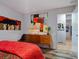Bedroom featuring a mid-century modern dresser and eclectic artwork at 1330 N Lockwood Ridge Rd, Sarasota, FL 34237