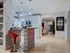 Modern kitchen with bar seating and stainless steel appliances at 1330 N Lockwood Ridge Rd, Sarasota, FL 34237