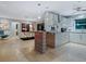 Bright kitchen open to living area, featuring stainless steel appliances at 1330 N Lockwood Ridge Rd, Sarasota, FL 34237