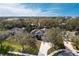 Aerial view of a beautiful home surrounded by lush greenery and mature trees at 2111 152Nd E Ct, Bradenton, FL 34212
