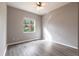 Bedroom featuring plank flooring and plenty of natural light at 2111 152Nd E Ct, Bradenton, FL 34212