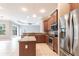 Updated kitchen featuring stainless steel appliances, granite countertops, and a breakfast bar at 2111 152Nd E Ct, Bradenton, FL 34212