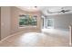 Bright living room with tile flooring and large window that offers a clear view to the pool at 2111 152Nd E Ct, Bradenton, FL 34212
