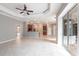 Open concept living space featuring tile floors, sliding glass doors, and seamless flow to other rooms at 2111 152Nd E Ct, Bradenton, FL 34212