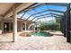 Inviting in-ground pool featuring a screened enclosure and beautiful brick patio at 2111 152Nd E Ct, Bradenton, FL 34212