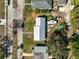 Aerial view of a single-story house with a metal roof and a tidy lawn at 2302 8Th W Ave, Bradenton, FL 34205