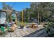 Outdoor patio with table and seating, surrounded by lush greenery, ideal for relaxing and entertaining at 2302 8Th W Ave, Bradenton, FL 34205