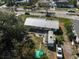 Aerial view of the backyard showing chairs, table, camper and car at 2302 8Th W Ave, Bradenton, FL 34205