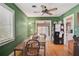 Inviting dining room featuring a wooden table, hardwood floors, and green walls at 2302 8Th W Ave, Bradenton, FL 34205