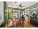 Cozy dining room with a wooden table, bench seating, and green walls at 2302 8Th W Ave, Bradenton, FL 34205