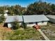 Aerial shot of single-story home featuring well maintained lawn and garden at 2302 8Th W Ave, Bradenton, FL 34205