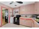 A second view of the kitchen offers plenty of counter space and the connection to the dining room at 2302 8Th W Ave, Bradenton, FL 34205