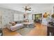 Bright living room featuring hardwood floors, a ceiling fan and a comfortable sectional sofa at 2302 8Th W Ave, Bradenton, FL 34205