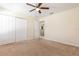 Cozy bedroom features carpet, a closet, and an open doorway to the rest of the home at 2347 Richwood Pike Dr, Ruskin, FL 33570