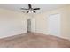 Bedroom featuring neutral walls, carpet flooring, ceiling fan, and a closet at 2347 Richwood Pike Dr, Ruskin, FL 33570