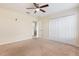 This bedroom features neutral walls, carpet flooring, and a closet for optimal storage at 2347 Richwood Pike Dr, Ruskin, FL 33570