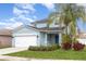 Charming two-story home with attached two car garage and well-manicured lawn at 2347 Richwood Pike Dr, Ruskin, FL 33570