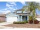 Charming two-story home featuring a two-car garage and a welcoming front porch with a lovely landscaped yard at 2347 Richwood Pike Dr, Ruskin, FL 33570