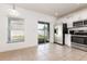 Eat-in kitchen area offering stainless steel appliances, a sliding glass door to the backyard, and plenty of natural light at 2347 Richwood Pike Dr, Ruskin, FL 33570