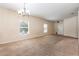 Living room with large windows that provide natural light and carpet flooring at 2347 Richwood Pike Dr, Ruskin, FL 33570