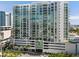 Modern, luxurious high-rise condo building boasting incredible views of the surrounding cityscape and waterfront from private balconies at 301 Quay Commons # 1106, Sarasota, FL 34236