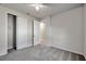 Bright bedroom with neutral walls, plush carpeting, a window, and closet at 3747 Laughing Dove Ave, Sun City Center, FL 33573