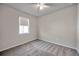 Neutral bedroom with carpet flooring, a window, and ceiling fan at 3747 Laughing Dove Ave, Sun City Center, FL 33573