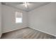 Bright bedroom with neutral walls, plush carpeting, a window, and a ceiling fan at 3747 Laughing Dove Ave, Sun City Center, FL 33573
