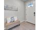 Inviting entryway with a decorative bench and tile flooring at 3747 Laughing Dove Ave, Sun City Center, FL 33573