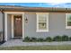 Stylish single-Gathering home showcases a welcoming front entrance and manicured landscaping at 3747 Laughing Dove Ave, Sun City Center, FL 33573