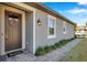 Stylish single-Gathering home features a welcoming front entrance and manicured landscaping at 3747 Laughing Dove Ave, Sun City Center, FL 33573