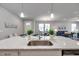 Kitchen island with marble countertop, stainless steel sink, and pendant lighting at 3747 Laughing Dove Ave, Sun City Center, FL 33573