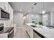 Modern kitchen featuring stainless steel appliances, ample counter space, and stylish finishes at 3747 Laughing Dove Ave, Sun City Center, FL 33573