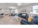 Open-concept living area with contemporary furnishings, a dining area, and seamless flow throughout the home at 3747 Laughing Dove Ave, Sun City Center, FL 33573
