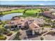 Aerial view of the golf course and community clubhouse with pristine landscaping at 5247 Esplanade Blvd, Bradenton, FL 34211