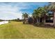View of the backyard and screened-in patio showcasing the property's outdoor living space at 5814 Cavano Dr, Sarasota, FL 34231