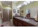 Bathroom features tile floors, granite counters, walk-in shower, and great lighting at 5814 Cavano Dr, Sarasota, FL 34231
