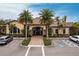 Community clubhouse showcasing its attractive architecture, landscaping, and convenient parking at 5814 Cavano Dr, Sarasota, FL 34231