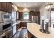 Spacious clubhouse kitchen offers modern appliances, ample counter space, and bar seating at 5814 Cavano Dr, Sarasota, FL 34231