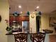 Charming kitchen with stainless steel appliances, granite countertops, and decorative pendant lighting at 5814 Cavano Dr, Sarasota, FL 34231