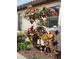 Lovely landscaping featuring colorful foliage and decorative accents enhances this home's curb appeal at 5814 Cavano Dr, Sarasota, FL 34231