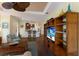 Comfortable living room with a large entertainment center and a view of the open-concept kitchen at 5814 Cavano Dr, Sarasota, FL 34231