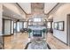 A bright lobby features a stone fireplace and several seating areas, creating a welcoming and stylish space at 5814 Cavano Dr, Sarasota, FL 34231